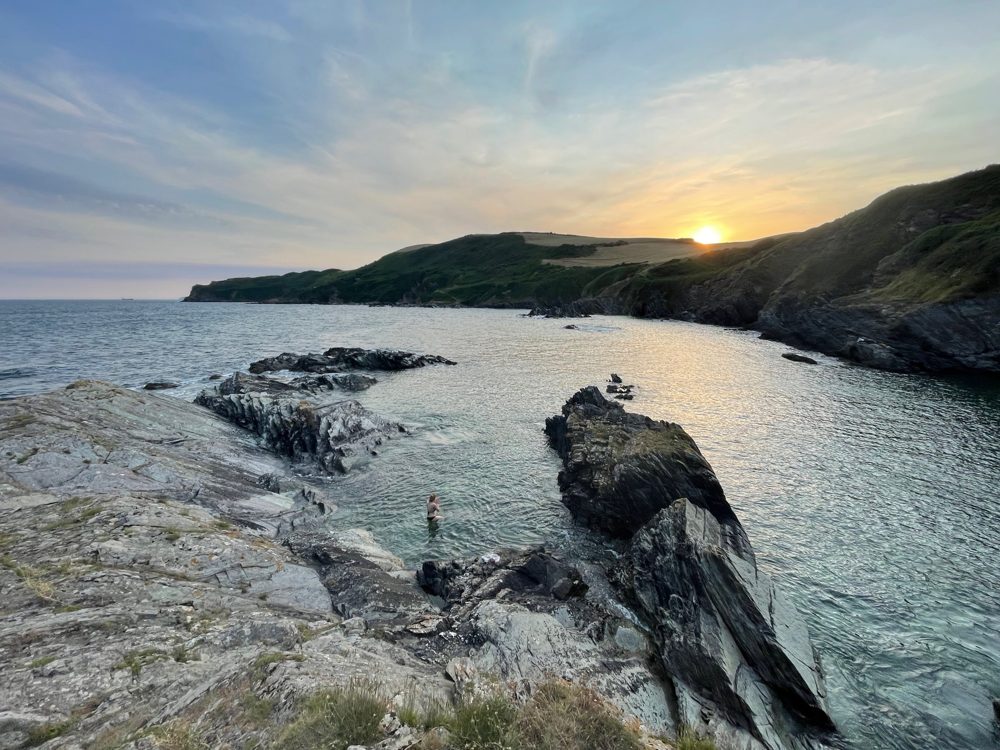 Sunset over a rocky Cornish cove